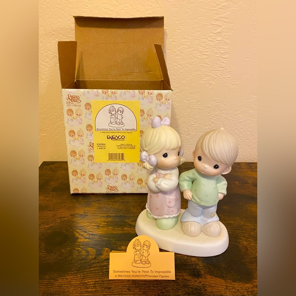 Artwork by the late Sam Butcher. Precious Moments Figurine.